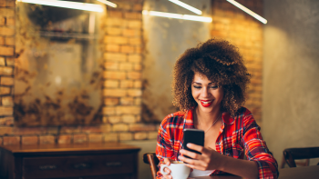 Young woman using mobile survey