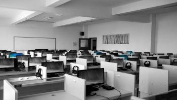 empty office showing segregated desks and computers