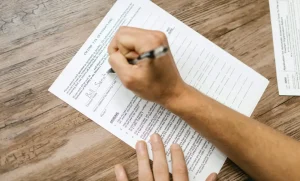 Picture showing someone filling out a questionnaire