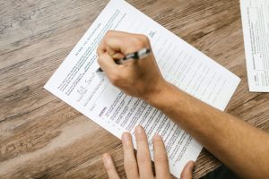 Picture showing someone filling out a questionnaire