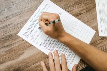 Picture showing someone filling out a questionnaire
