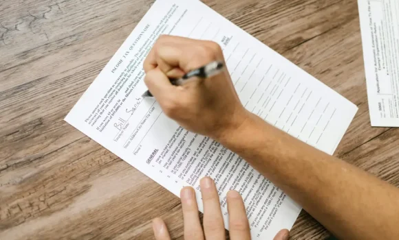 Picture showing someone filling out a questionnaire