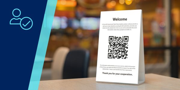 Check-in sign in restaurant featuring a QR code.
