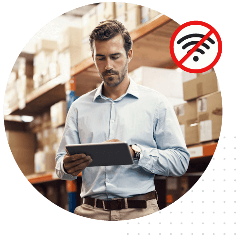 A person using a tablet in a business warehouse.